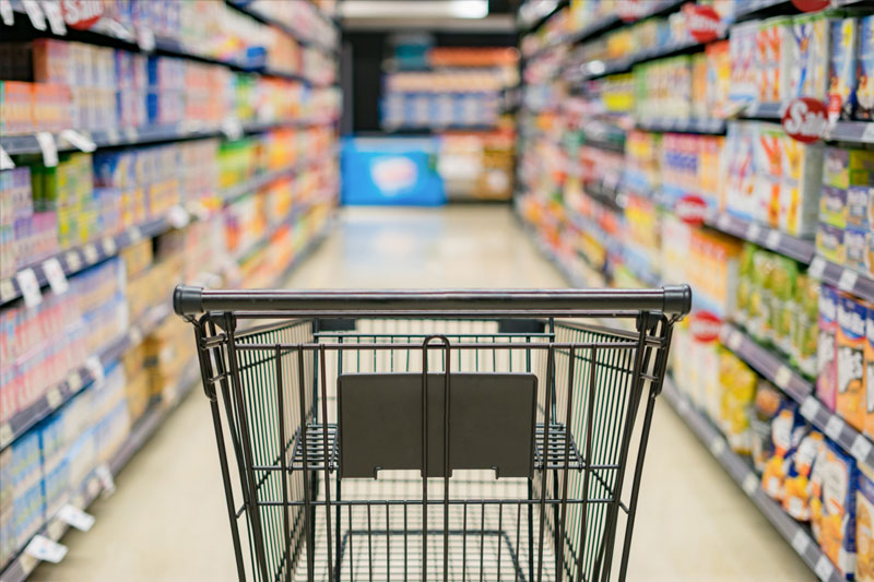 Hypermarkets Display Snacks on the Side of an Escalator