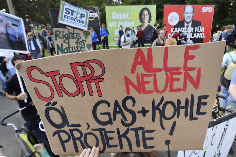 Anti-Oil Activists Glue Themselves to Paintings to Protest